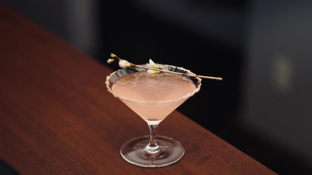 VUELTA - Pink cocktail with sakura garnish